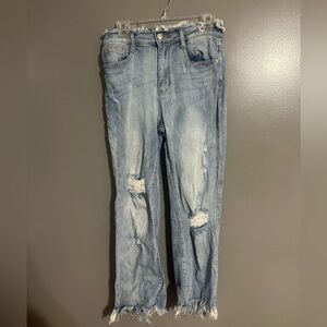 Light wash jeans with a few rips.